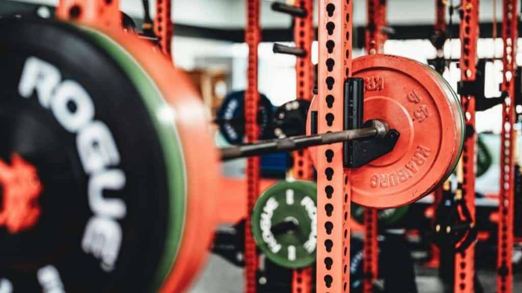 A barbell and weights in a gym