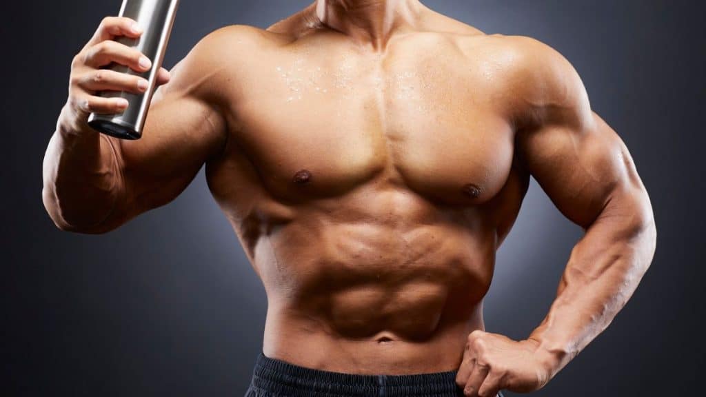 Muscular Man Holding a Protein Shaker