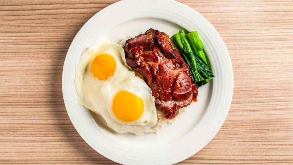 What Are the Best Budget High-Protein Foods? A plate of eggs, steak and asparagus